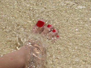 rp_Belize-4-Silk-Caye-foot-and-red-painted-toes-on-the-beach-in-sand-and-water.jpg
